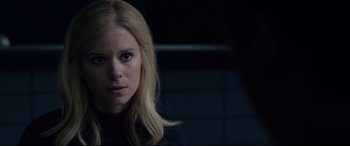 Movie still from “Fantastic Four” (2015), directed by Josh Trank – A woman with long blonde hair is looking at the camera; Close Up shot, Over the shoulder angle