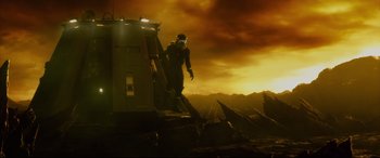 Movie still from “Fantastic Four” (2015), directed by Josh Trank – A man standing on top of a boat in the water; Wide shot, Low angle