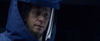 Movie still from “Fantastic Four” (2015), directed by Josh Trank – An older man wearing a helmet looking into a mirror; Close Up shot, Over the shoulder angle
