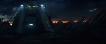 Movie still from “Fantastic Four” (2015), directed by Josh Trank – A truck is parked on the side of a mountain; Extreme Wide shot, Low angle
