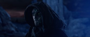 Movie still from “Fantastic Four” (2015), directed by Josh Trank – A man in a black hooded jacket with green eyes; Close Up shot, Low angle