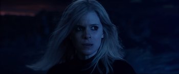 Movie still from “Fantastic Four” (2015), directed by Josh Trank – A person with long blonde hair; Close Up shot, Over the shoulder angle