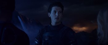 Movie still from “Fantastic Four” (2015), directed by Josh Trank – A man in a black outfit standing in front of a dark background; Close Up shot, Low angle