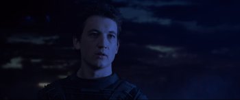 Movie still from “Fantastic Four” (2015), directed by Josh Trank – A young man is looking into the distance in the dark; Close Up shot, Low angle