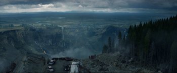 Movie still from “Fantastic Four” (2015), directed by Josh Trank – A group of people standing on top of a mountain; Extreme Wide shot, High angle