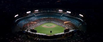 Movie still from “Fantastic Four: Rise of the Silver Surfer” (2007), directed by Tim Story – An aerial view of a baseball field at night; Extreme Wide shot, Overhead angle
