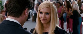 Movie still from “Fantastic Four: Rise of the Silver Surfer” (2007), directed by Tim Story – A woman with long blonde hair wearing a black top; Close Up shot, Over the shoulder angle