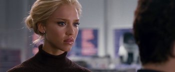 Movie still from “Fantastic Four: Rise of the Silver Surfer” (2007), directed by Tim Story – A woman with blonde hair wearing a brown sweater; Close Up shot, Over the shoulder angle