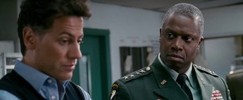 Movie still from “Fantastic Four: Rise of the Silver Surfer” (2007), directed by Tim Story – A man in a military uniform talking to another man in a uniform; Close Up shot, Over the shoulder angle