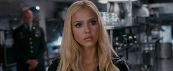 Movie still from “Fantastic Four: Rise of the Silver Surfer” (2007), directed by Tim Story – A woman with long blonde hair and blue eyes looking at the camera; Close Up shot, Over the shoulder angle