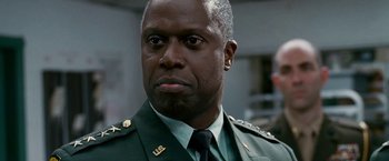 Movie still from “Fantastic Four: Rise of the Silver Surfer” (2007), directed by Tim Story – A person wearing a uniform; Close Up shot, Low angle