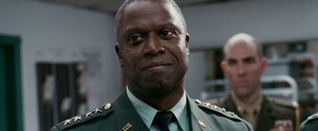 Movie still from “Fantastic Four: Rise of the Silver Surfer” (2007), directed by Tim Story – A person wearing a military uniform; Close Up shot, Low angle
