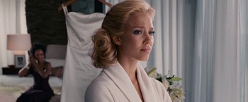 Movie still from “Fantastic Four: Rise of the Silver Surfer” (2007), directed by Tim Story – A woman with blonde hair and blue eye shadow; Close Up shot, Over the shoulder angle