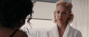 Movie still from “Fantastic Four: Rise of the Silver Surfer” (2007), directed by Tim Story – A woman in a bathrobe looking at a woman in a white robe in front of a window; Close Up shot, Over the shoulder angle