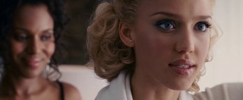 Movie still from “Fantastic Four: Rise of the Silver Surfer” (2007), directed by Tim Story – A woman's blue eye makeup; Close Up shot, Over the shoulder angle