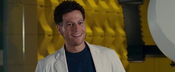 Movie still from “Fantastic Four: Rise of the Silver Surfer” (2007), directed by Tim Story – A man in a white jacket smiling for the camera; Close Up shot, Low angle