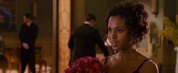 Movie still from “Fantastic Four: Rise of the Silver Surfer” (2007), directed by Tim Story – A beautiful woman holding a bouquet of red flowers; Close Up shot, Over the shoulder angle