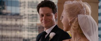 Movie still from “Fantastic Four: Rise of the Silver Surfer” (2007), directed by Tim Story – A person wearing a suit and tie; Close Up shot, Over the shoulder angle