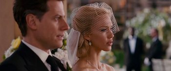 Movie still from “Fantastic Four: Rise of the Silver Surfer” (2007), directed by Tim Story – A woman with a veil on her head looking at a man; Close Up shot, Over the shoulder angle