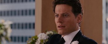 Movie still from “Fantastic Four: Rise of the Silver Surfer” (2007), directed by Tim Story – A person wearing a suit and tie; Close Up shot, Over the shoulder angle
