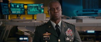 Movie still from “Fantastic Four: Rise of the Silver Surfer” (2007), directed by Tim Story – A person wearing a military uniform; Close Up shot, Low angle