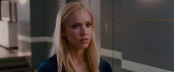 Movie still from “Fantastic Four: Rise of the Silver Surfer” (2007), directed by Tim Story – A woman with blonde hair and blue eyes looking at the camera; Close Up shot, Over the shoulder angle