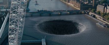 Movie still from “Fantastic Four: Rise of the Silver Surfer” (2007), directed by Tim Story – An aerial view of a large hole in the water; Extreme Wide shot, High angle