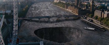 Movie still from “Fantastic Four: Rise of the Silver Surfer” (2007), directed by Tim Story – An aerial view of a large hole in the ground; Extreme Wide shot, High angle