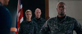 Movie still from “Fantastic Four: Rise of the Silver Surfer” (2007), directed by Tim Story – A group of people standing in front of a mirror; Medium shot, Over the shoulder angle