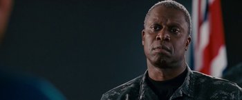 Movie still from “Fantastic Four: Rise of the Silver Surfer” (2007), directed by Tim Story – An older man in a military uniform looking at the camera; Close Up shot, Low angle