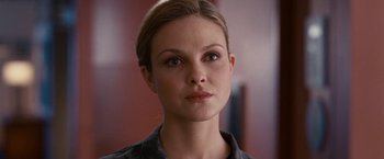 Movie still from “Fantastic Four: Rise of the Silver Surfer” (2007), directed by Tim Story – A woman that is looking at the camera; Close Up shot, Over the shoulder angle