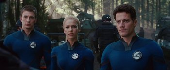 Movie still from “Fantastic Four: Rise of the Silver Surfer” (2007), directed by Tim Story – A group of people standing next to each other in a forest; Medium shot, Over the shoulder angle