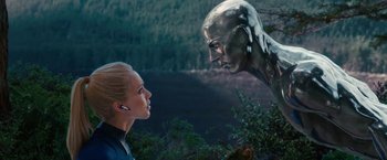 Movie still from “Fantastic Four: Rise of the Silver Surfer” (2007), directed by Tim Story – A woman looking at a silver statue in a forest; Close Up shot, Low angle