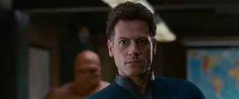 Movie still from “Fantastic Four: Rise of the Silver Surfer” (2007), directed by Tim Story – A person wearing a suit and tie; Close Up shot, Low angle
