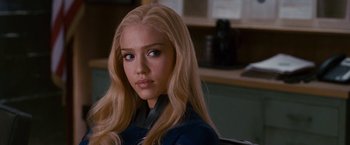 Movie still from “Fantastic Four: Rise of the Silver Surfer” (2007), directed by Tim Story – A beautiful young woman with long blonde hair and blue eyes; Close Up shot, Over the shoulder angle