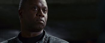 Movie still from “Fantastic Four: Rise of the Silver Surfer” (2007), directed by Tim Story – A person wearing a black shirt; Close Up shot, Low angle