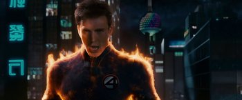 Movie still from “Fantastic Four: Rise of the Silver Surfer” (2007), directed by Tim Story – A man in a black and red suit with fire; Close Up shot, Low angle