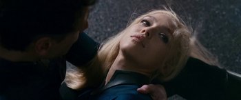 Movie still from “Fantastic Four: Rise of the Silver Surfer” (2007), directed by Tim Story – A woman with blond hair is lying down on the ground with another woman; Close Up shot, Overhead angle