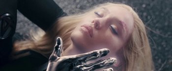 Movie still from “Fantastic Four: Rise of the Silver Surfer” (2007), directed by Tim Story – A woman laying on the ground with her eyes closed; Close Up shot, Overhead angle