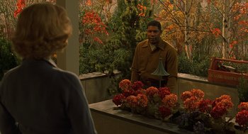 Movie still from “Far from Heaven” (2002), directed by Todd Haynes – A man and a woman are sitting on a bench; Medium shot, Over the shoulder angle