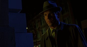 Movie still from “Far from Heaven” (2002), directed by Todd Haynes – A man wearing a hat and a coat; Close Up shot, Low angle
