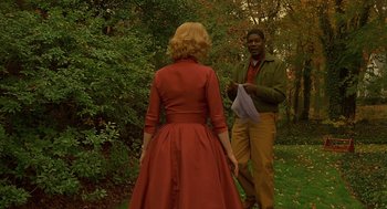 Movie still from “Far from Heaven” (2002), directed by Todd Haynes – A man and a woman standing in the grass; Medium shot, Over the shoulder angle