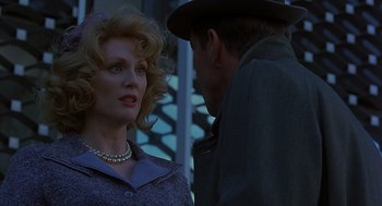 Movie still from “Far from Heaven” (2002), directed by Todd Haynes – An older man and a younger woman are talking to each other; Close Up shot, Over the shoulder angle