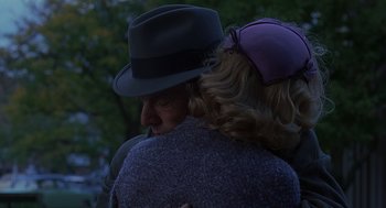 Movie still from “Far from Heaven” (2002), directed by Todd Haynes – A man and a woman embracing each other; Close Up shot, Low angle