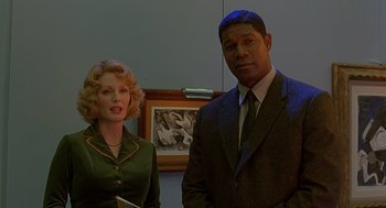 Movie still from “Far from Heaven” (2002), directed by Todd Haynes – A man and a woman standing next to each other in a room; Medium shot, Low angle