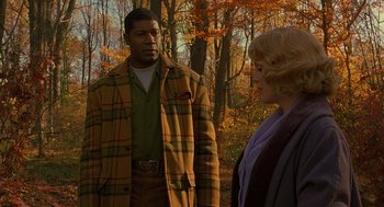 Movie still from “Far from Heaven” (2002), directed by Todd Haynes – A man and a woman standing in the woods; Medium shot, Over the shoulder angle