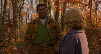 Movie still from “Far from Heaven” (2002), directed by Todd Haynes – A man and a woman talking in the woods; Medium shot, Over the shoulder angle