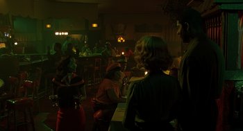 Movie still from “Far from Heaven” (2002), directed by Todd Haynes – A group of people sitting at tables in a room; Medium shot, Over the shoulder angle