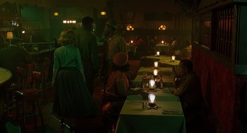 Movie still from “Far from Heaven” (2002), directed by Todd Haynes – A group of people sitting at a table in a room; Wide shot, High angle