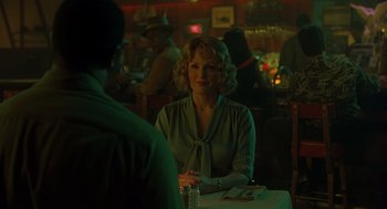 Movie still from “Far from Heaven” (2002), directed by Todd Haynes – A woman sitting at a table in front of a man; Medium shot, Over the shoulder angle